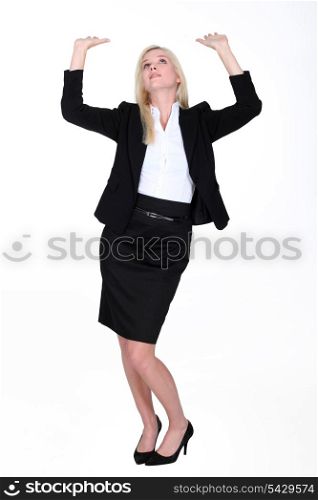 Woman raising arms towards the sky