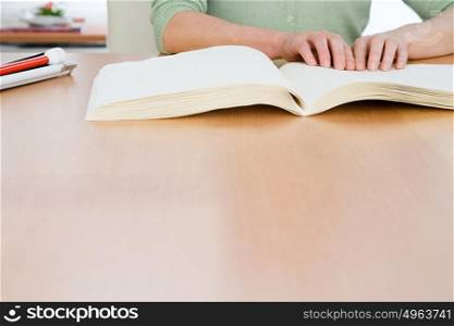 Woman reading a braille book