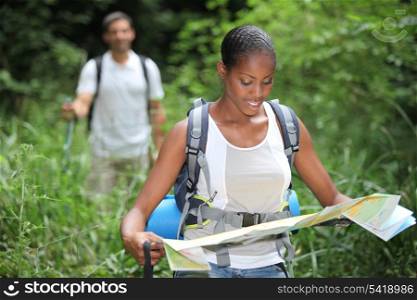 Woman reading a map during a hike