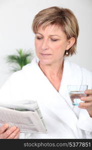 Woman reading a newspaper