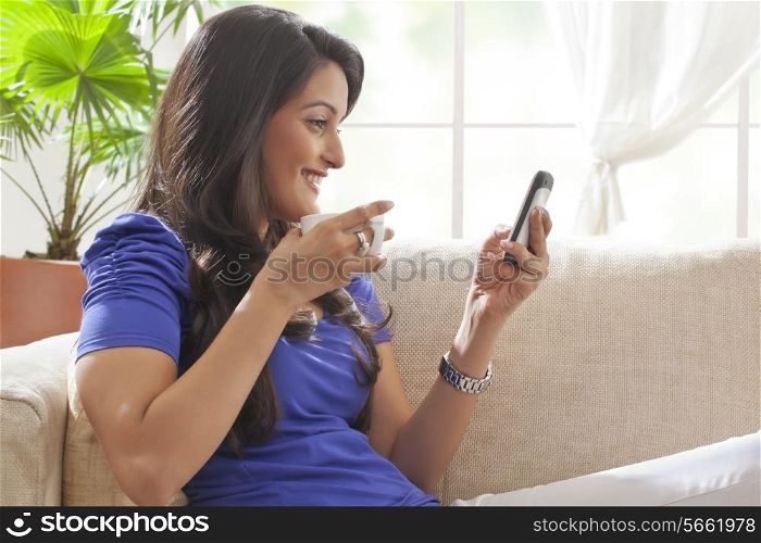 Woman reading an sms on a mobile phone