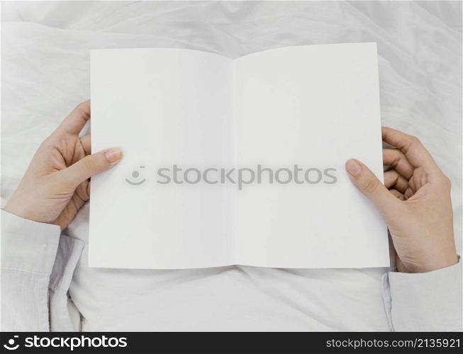 woman reading book alone