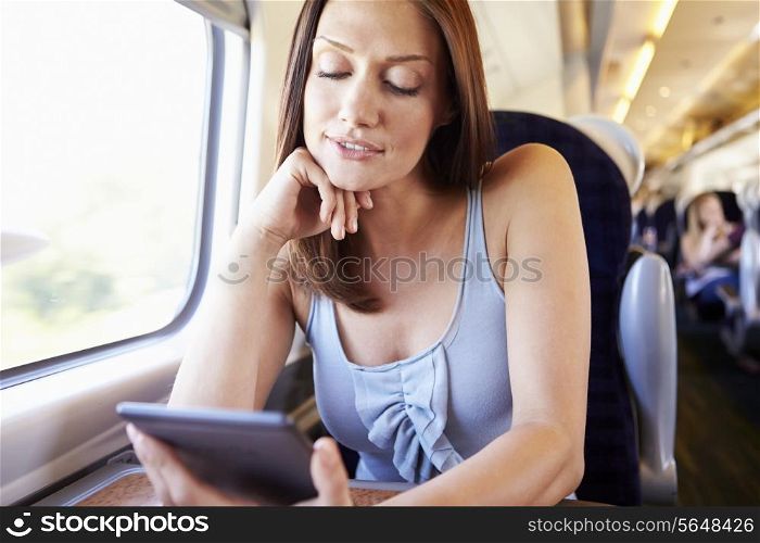 Woman Reading E Book On Train