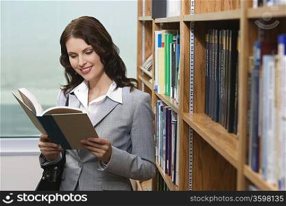 Woman reading in library