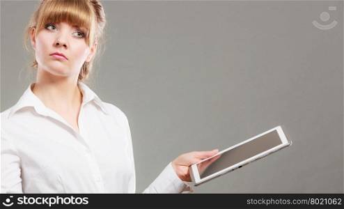 Woman reading learning with ebook. Education. Thinking woman reading and learning with ebook digital tablet. Education leisure. Young girl in white shirt studying for exam.