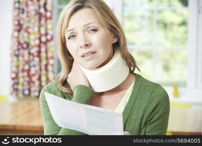 Woman Reading Letter After Receiving Neck Injury
