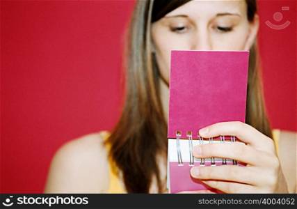 Woman reading notebook