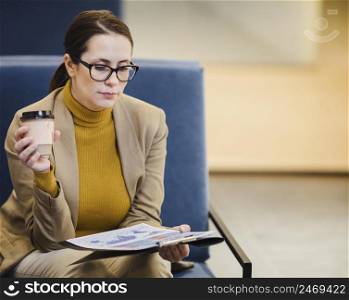 woman reading paper
