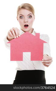 Woman real estate agent holding red paper house. Surprised shocked face expression. Property business and accomodation or loan concept isolated on white background