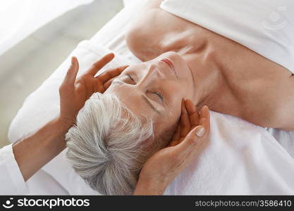 Woman Receiving a Facial Massage