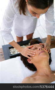 Woman receiving a massage at the spa