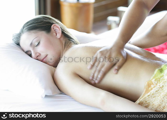 Woman receiving back massage