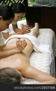 Woman receiving back massage