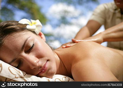 Woman receiving back massage