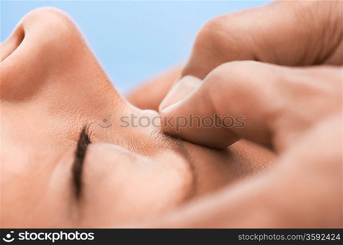 Woman receiving massage close-up of upper face