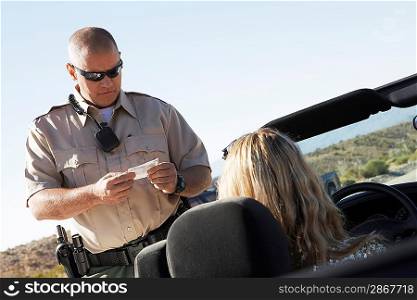 Woman Receiving Speeding Ticket