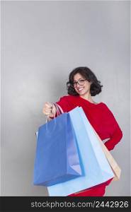 woman red giving shopping bags