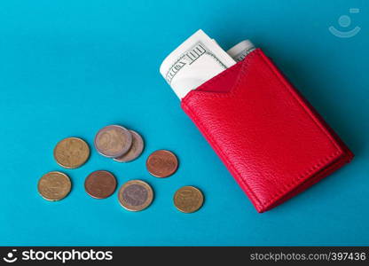 woman red purse with dollars banknote on a blue background