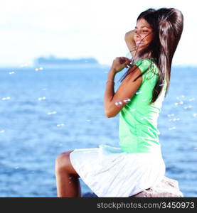 woman relax blue sea and bubbles on background