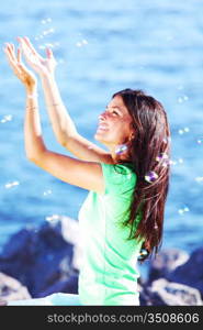 woman relax blue sea and bubbles on background