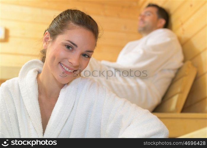 woman relaxes in a dry sauna