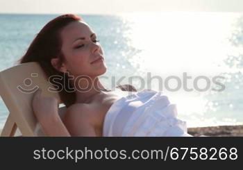 Woman relaxing at the beach on vacation