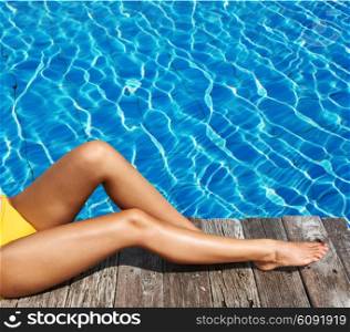 Woman relaxing at the pool