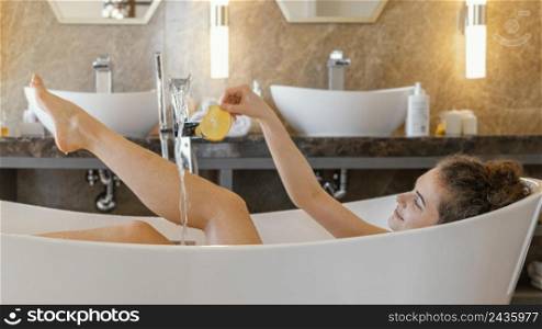 woman relaxing bathtub while bathing 2