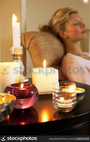 Woman Relaxing by Candles
