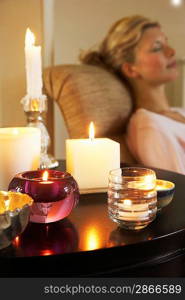 Woman Relaxing by Candles