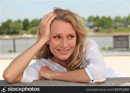 Woman relaxing by lake