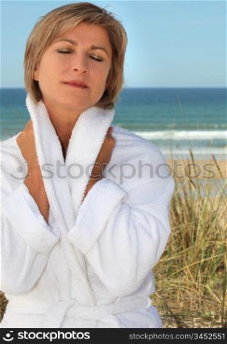 Woman relaxing by the seaside