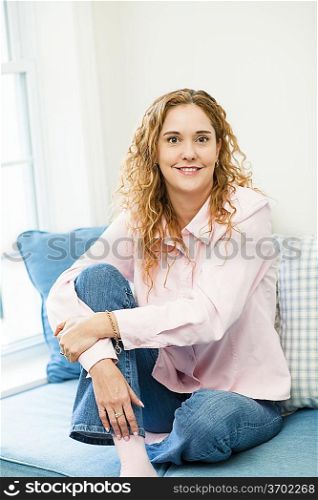 Woman relaxing by the window