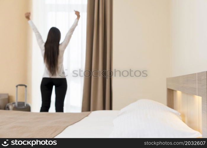 woman relaxing hotel room