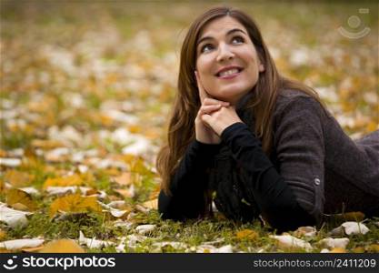 Woman relaxing in a beautiful day of autumn