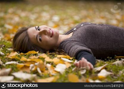 Woman relaxing in a beautiful day of autumn