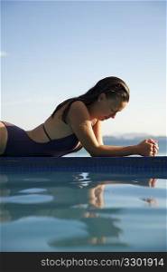 Woman relaxing in a swimming pool