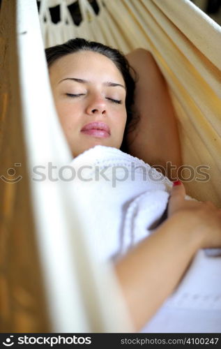 Woman relaxing in an hammock