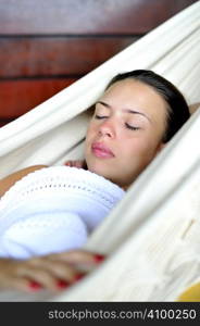 Woman relaxing in an hammock