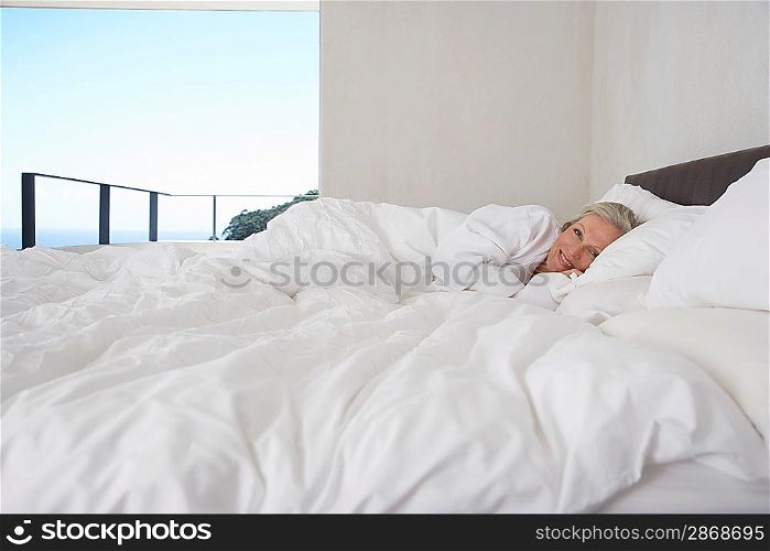 Woman Relaxing in Bed