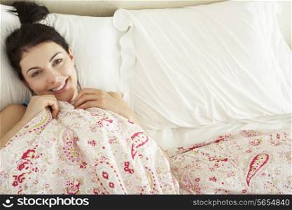 Woman Relaxing In Bed