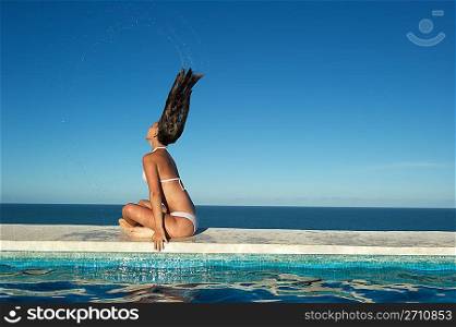 Woman relaxing in the spa swimming pool