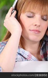 Woman relaxing listening to music