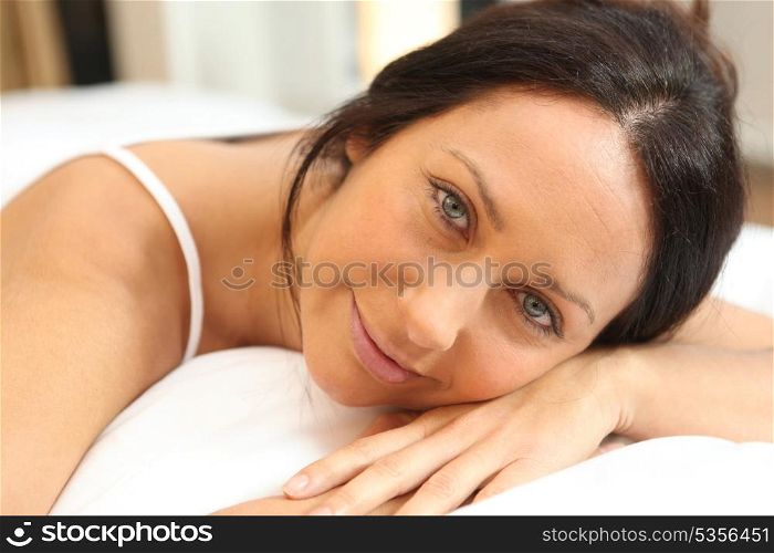 Woman relaxing on a bed