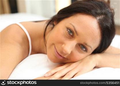 Woman relaxing on a bed