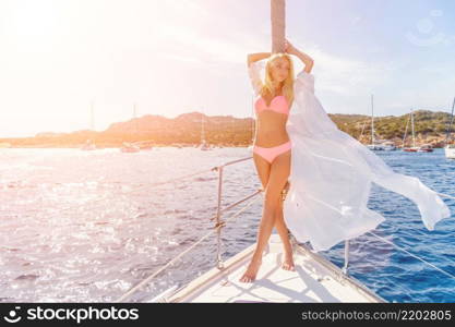 woman relaxing on a cruise boat wearing white tunic. woman relaxing on a cruise boat wearing tunic