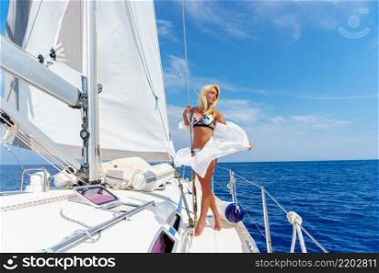 woman relaxing on a cruise boat wearing white tunic. woman relaxing on a cruise boat wearing tunic