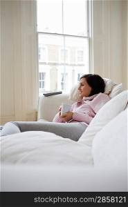Woman Relaxing on Sofa