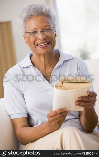 Woman relaxing with a book and smiling