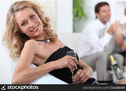 Woman relaxing with a glass of champagne